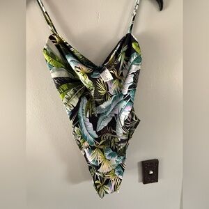 NWT multi colored one piece. Super cute!